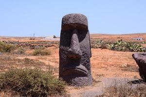 View of a desert landscape with Moai head photo