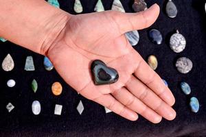 Hand holding a gemstone photo