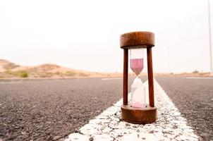 Hourglass on the road photo