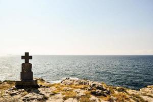 Gravestone on the coast photo