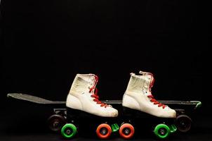 Roller skates and skateboard photo