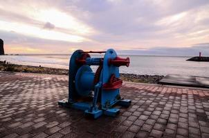 Old Vintage Metal Winch in a Port Harbor photo