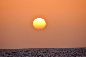 Sunset over the sea photo