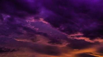 the background of orange twilight clouds at sunset photo