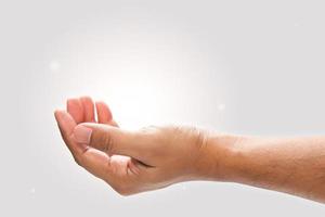 Male hand to hold something on a gray background. photo