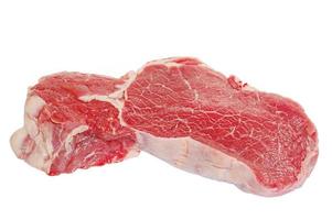 A piece of raw meat isolate. Raw beef steak on a white background. photo