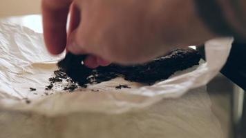 male hand touches the leaves of shu pu-erh tea. video