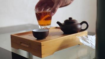 A tea master pours magical chinese tea