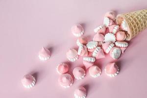 Scattered pink and white decor for baking, meringue in waffle cookies photo