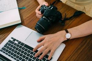 The camera is turned on against the background of a working laptop photo