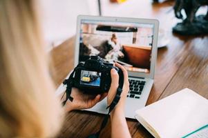 The camera is turned on against the background of a working laptop photo