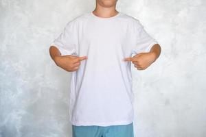 The child is wearing a white T-shirt. Place for advertising photo