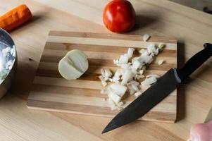 Diced onions are lying on a cutting board photo