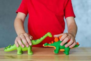 A child plays with animal figures photo