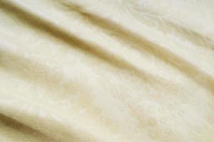 yellow cream texture fabric with little flora decoration photo