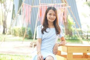 Happy Asian woman in a coffee shop photo