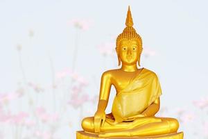 Makha Asanaha Visakha Bucha Day Golden Buddha image. Background of Bodhi leaves with shining light. Soft image and smooth focus style photo