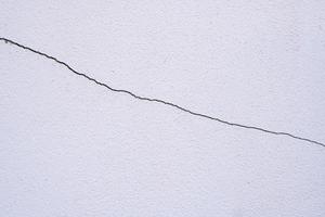 cracked house wall cement background photo