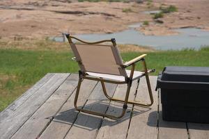 Camping chair on old wooden floor photo