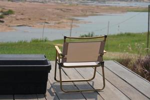 Camping chair on old wooden floor photo