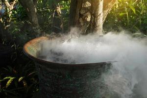 fog machine or automatic smoke in a clay jar add beauty Add dimension, look cool, decorate rooms and gardens both indoor and outdoor. soft and selective focus. photo