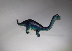 Dinosaur toy on a white background. photo