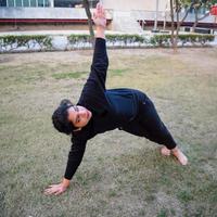 Young Indian woman practicing yoga outdoor in a park. Beautiful girl practice basic yoga pose. Calmness and relax, female happiness. Basic Yoga poses outdoor photo