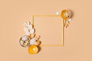 Frame with copy space and Easter eggs composition decorated with twigs and flowers. Easter flat lay monochrome photo