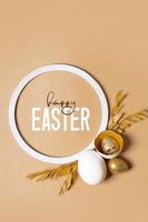 Happy Easter text with twigs and eggs composition. Easter greeting card vertical format photo