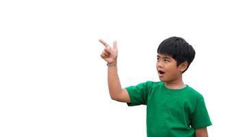 The boy smiled and pointed his hand to his side. on a white background photo