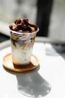 ice coffee and cream drink with selective focus in sunny day photo