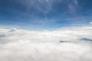 Sky and clouds view from inside the plane photo