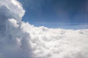 Sky and clouds view from inside the plane photo