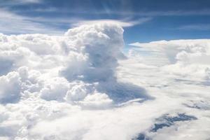 Sky and clouds view from inside the plane photo