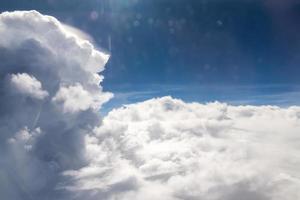 Sky and clouds view from inside the plane photo