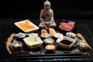 different Kinds of asia seafood sushi on a slate photo