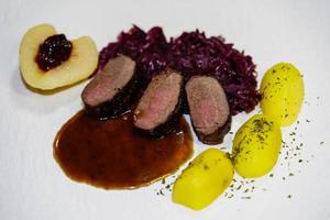 saddle of venison with herbs and spices photo