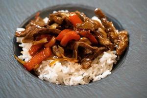 asian kitchen spicy curry with vegetables and rice photo