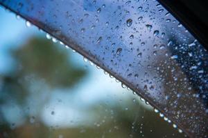 Dew drop on the car glass after heavy rains fall. photo