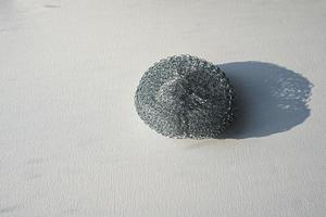 Sponge made of metal wire for washing dishes. photo