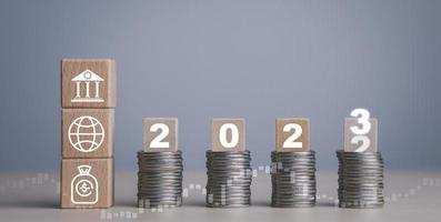 Double exposure of coins on the white background for finance and banking and Money spending planning, and investment budget, Business saving money concept, Copy space, new year 2022-2023 concept photo