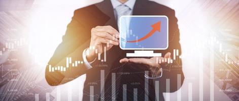 Business losses on the stock market chart concept, Business use pen touch line market chart and Red arrows fall to the ground, indicating the economic recession that will occur in 2023 photo