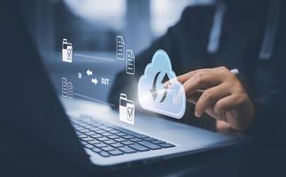 Cloud technology concept Global network of metaverse systems concept, Man hand touch data with internet cloud technology and File Transfer backup copy,Global business  Internet for Telecommunication photo