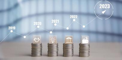 Double exposure of coins on the white background for finance and banking and Money spending planning, and investment budget, Business saving money concept, Copy space, new year 2022-2023 concept photo