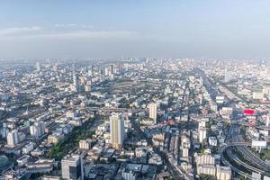 Bad air pollution in City. PM 2.5 dust in Bangkok or center city, Capital city are covered by heavy smog, Misty morning and sunrise in downtown with bad air pollution, Place to risk of cancer,Thailand photo