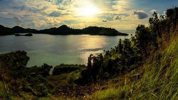 Coast landscape with island and hill photo