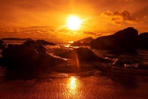 Beautiful orange sky sunset with rocks photo