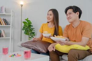 cheerful couple cheer sport, watching sporting, cheering for victory of their team. Happy energetic smiling. tv show, holiday, relax, recreation, soccer, football, series, cinema, cheer, win, fan club photo