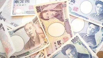 Many of the Japanese yen bank notes currency. photo