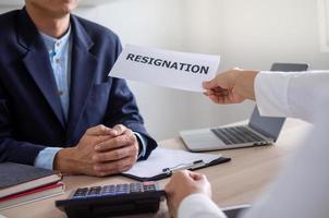 Businessmen send a letter of resignation to the boss photo
